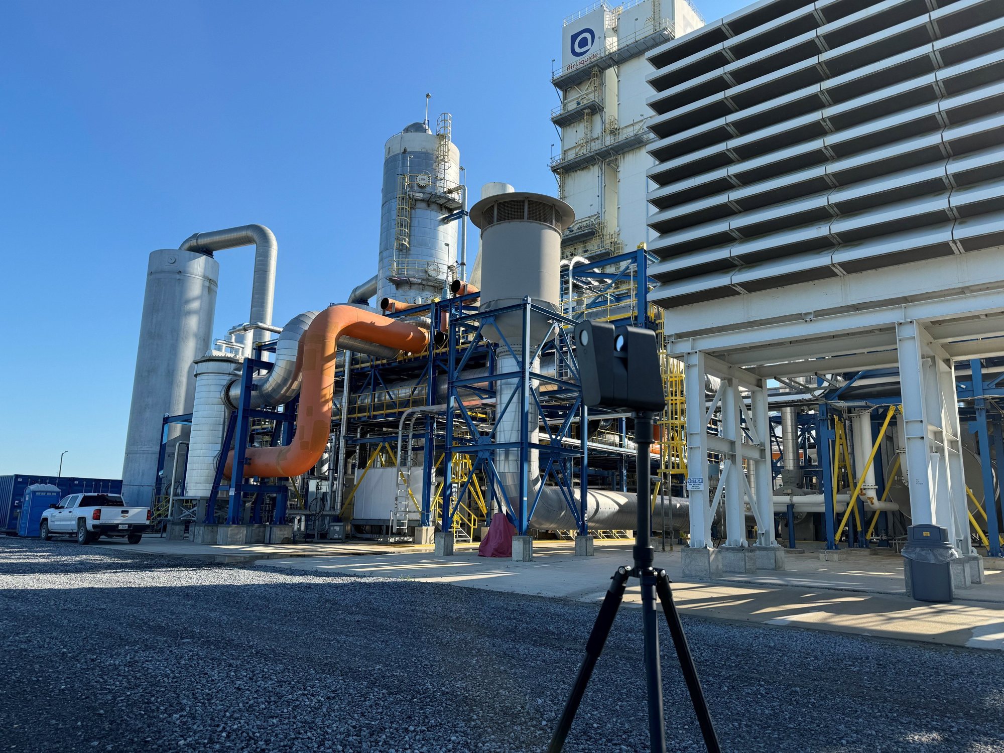 LiDAR capture camera on a tripod at an industrial facility