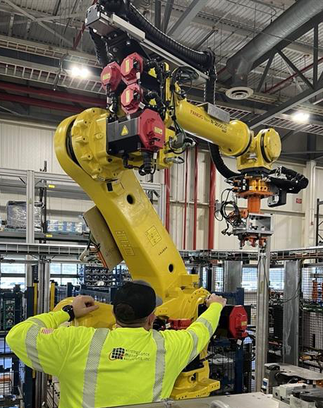 Technician working on an industrial robot